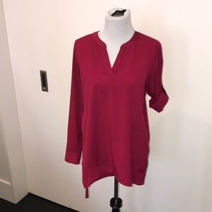 Long asymmetric polyester top